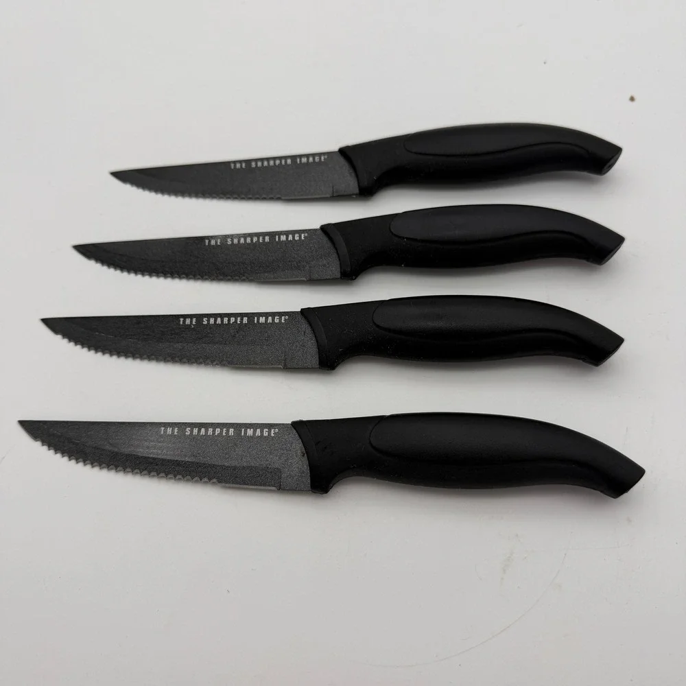 The Sharper Image 4 Piece Steak Knife Set Black Non-Stick Serrated Blade Utility